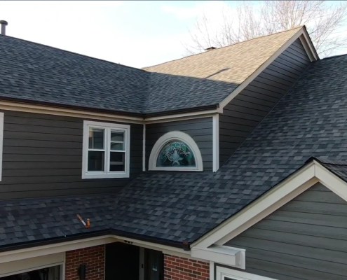 Hardie Siding Installation in Progress: Expert contractors installing durable fiber cement Hardie Siding on a home exterior.