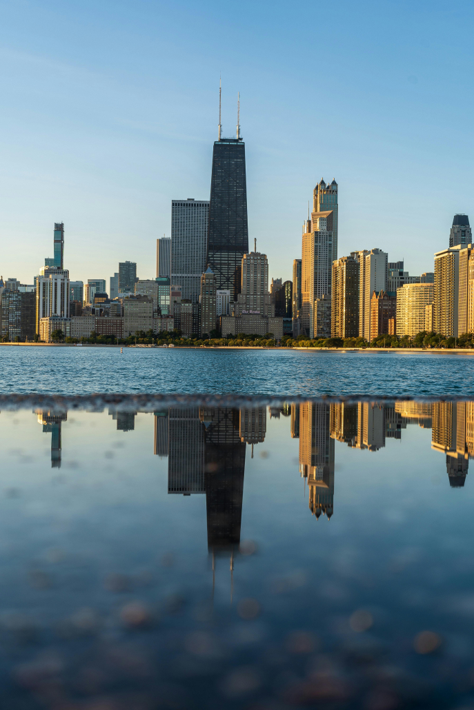 Chicago skyline reflected in water.
