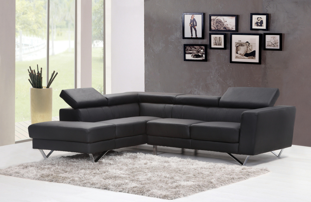 A black leather sectional sofa in a living room, one of the best furniture pieces from Chicago stores.