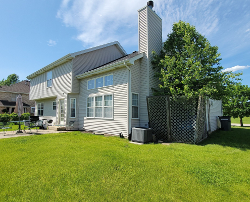 suburban home in Buffalo Grove with white siding