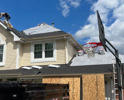 Revived Exteriors roofers on a roof in Buffalo Grove IL