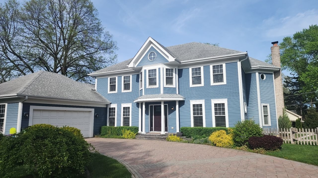 Arlington Heights home before full exterior renovation including roof replacement, James Hardie siding, and new gutters by Revived Exteriors.