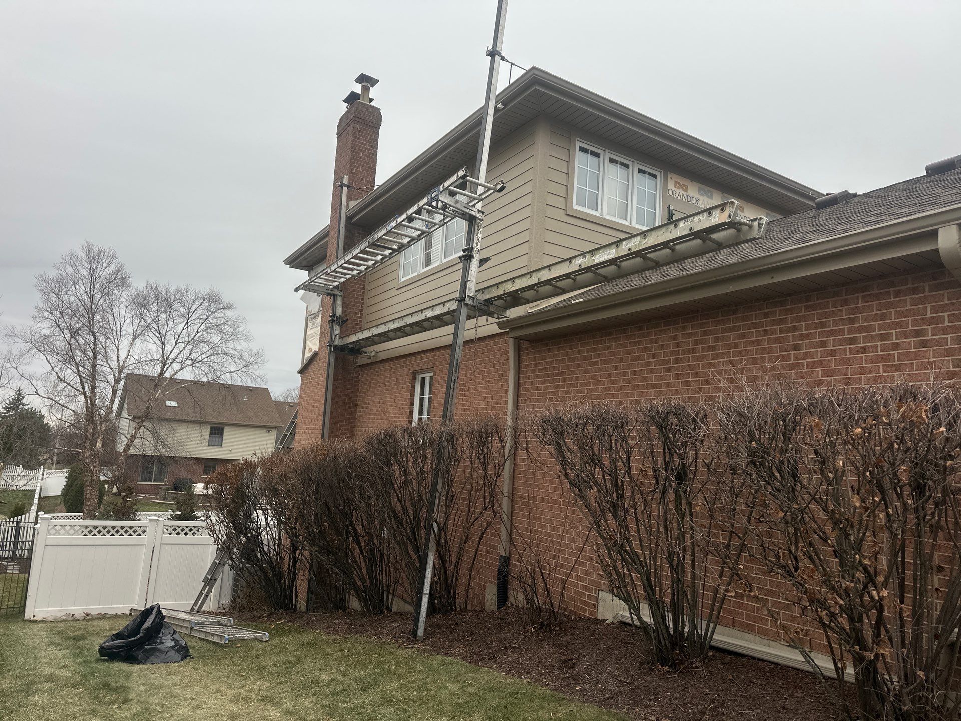 James Hardie siding installation in progress using ladder jacks in Lemont IL